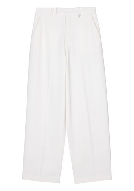 Pantaloni con placca logo taglio sartoriale in bianco Giuseppe Di Morabito - donna