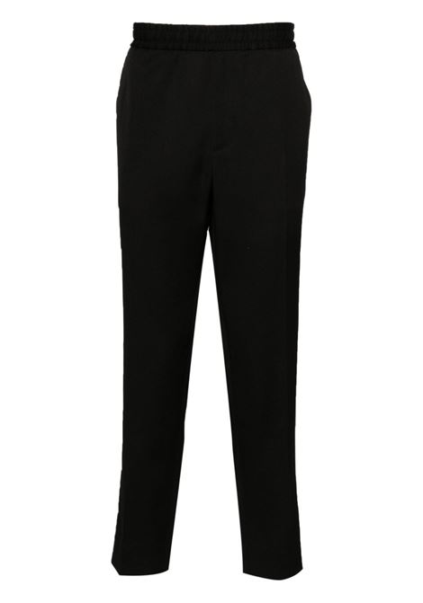 Pantaloni con logo in nero Golden Goose - uomo GOLDEN GOOSE | Pantaloni | GMP00581P00117090100