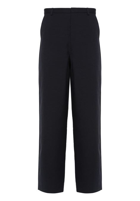 Blue interwoven tapered trousers - men