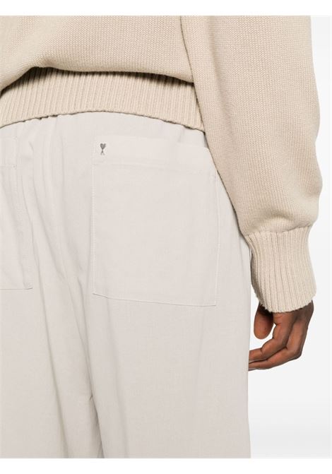 Pantaloni a gamba ampia in beige - uomo AMI PARIS | HTR211CO0062271