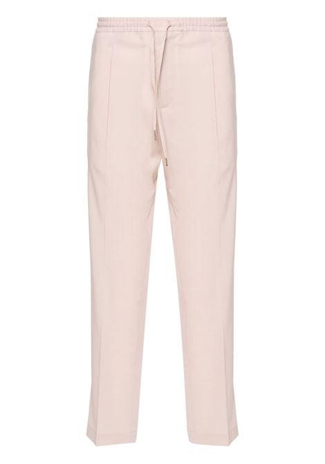 Pantaloni affusolati in rosa - uomo