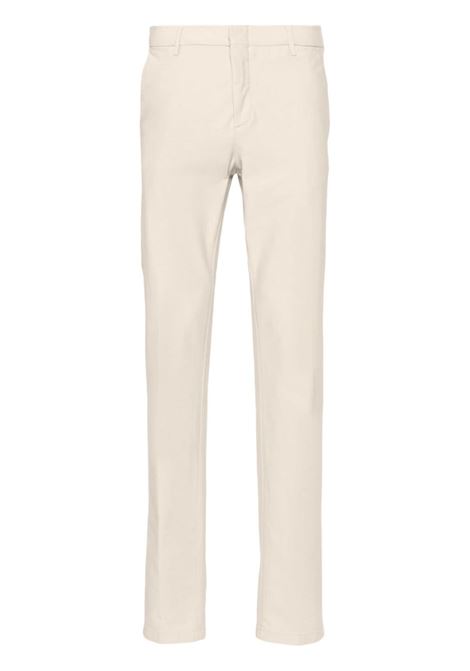 Beige low-rise tapered trousers - men