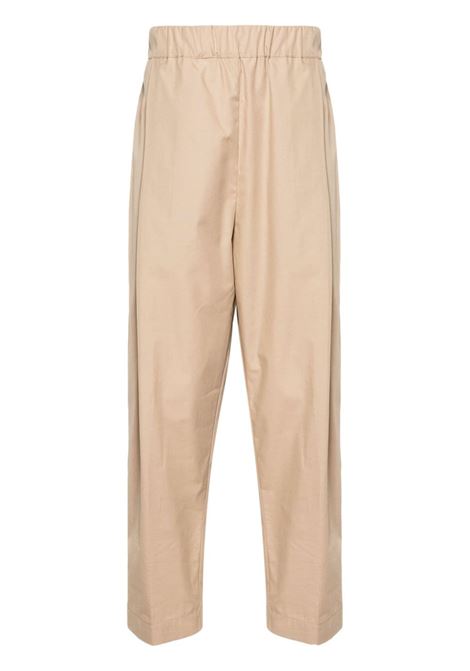 Pantaloni con vita elasticizzata in beige - uomo