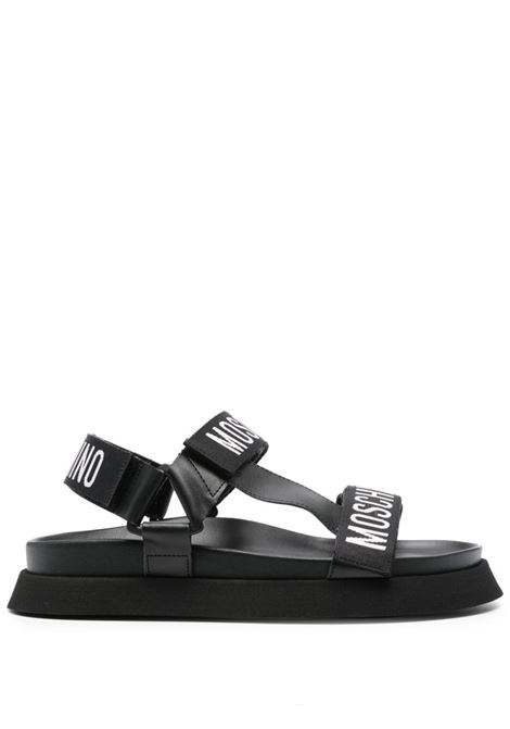 Black logo-tape flat sandals Moschino - women