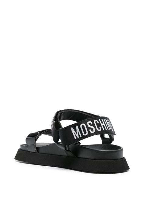 Black logo-tape flat sandals Moschino - women MOSCHINO | MA16244G1IMU0000