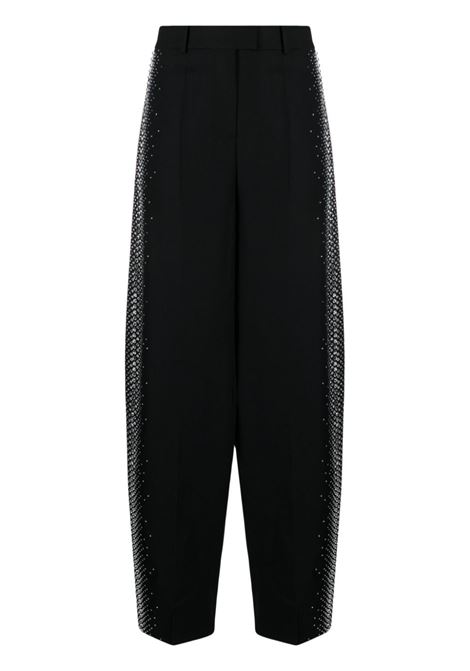 Pantaloni Jagger a gamba ampia in nero - donna