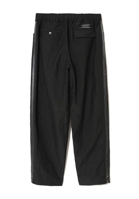 Pantaloni con vita elasticizzata in nero - uomo UNDERCOVER | UC1D45112CHRCL
