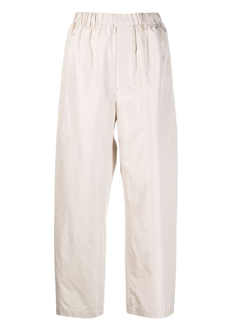 Pantaloni dritti con ruches in beige - uomo