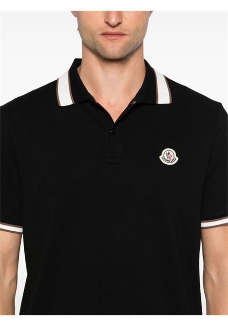 Polo con logo in nero Moncler - uomo MONCLER | 8A0001889A16999