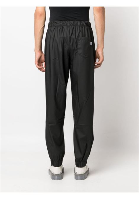 Pantaloni con coulisse di Rains in nero - unisex RAINS | RA18560BLA