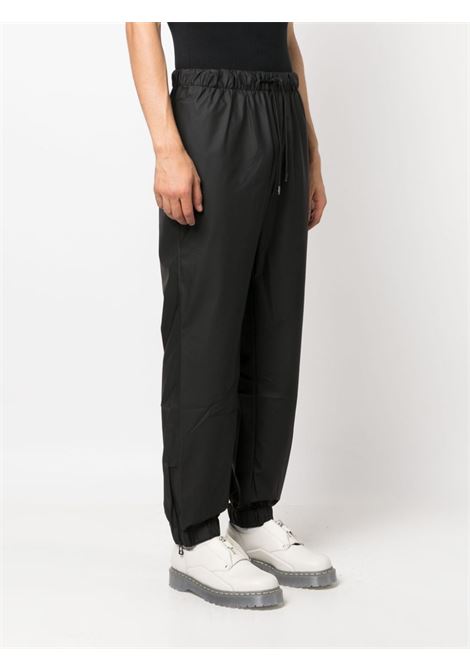 Pantaloni con coulisse di Rains in nero - unisex RAINS | RA18560BLA