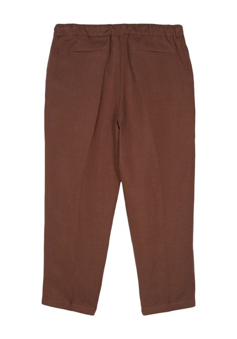 Brown pressed-crease tapered trousers - men COSTUMEIN | W3911502