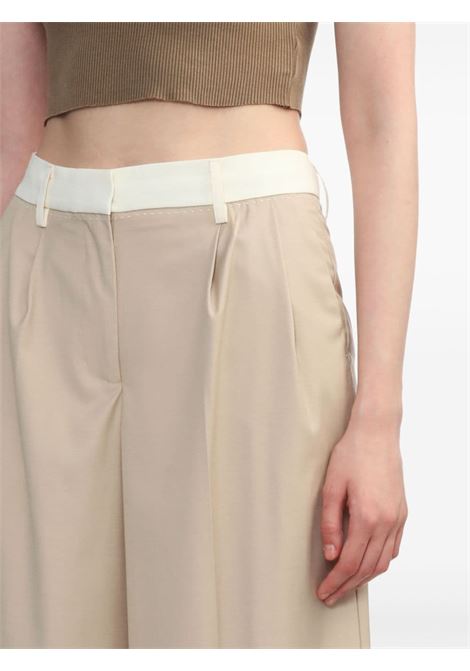 Beige wide-leg tailored trousers - women REMAIN | 5013242764151116